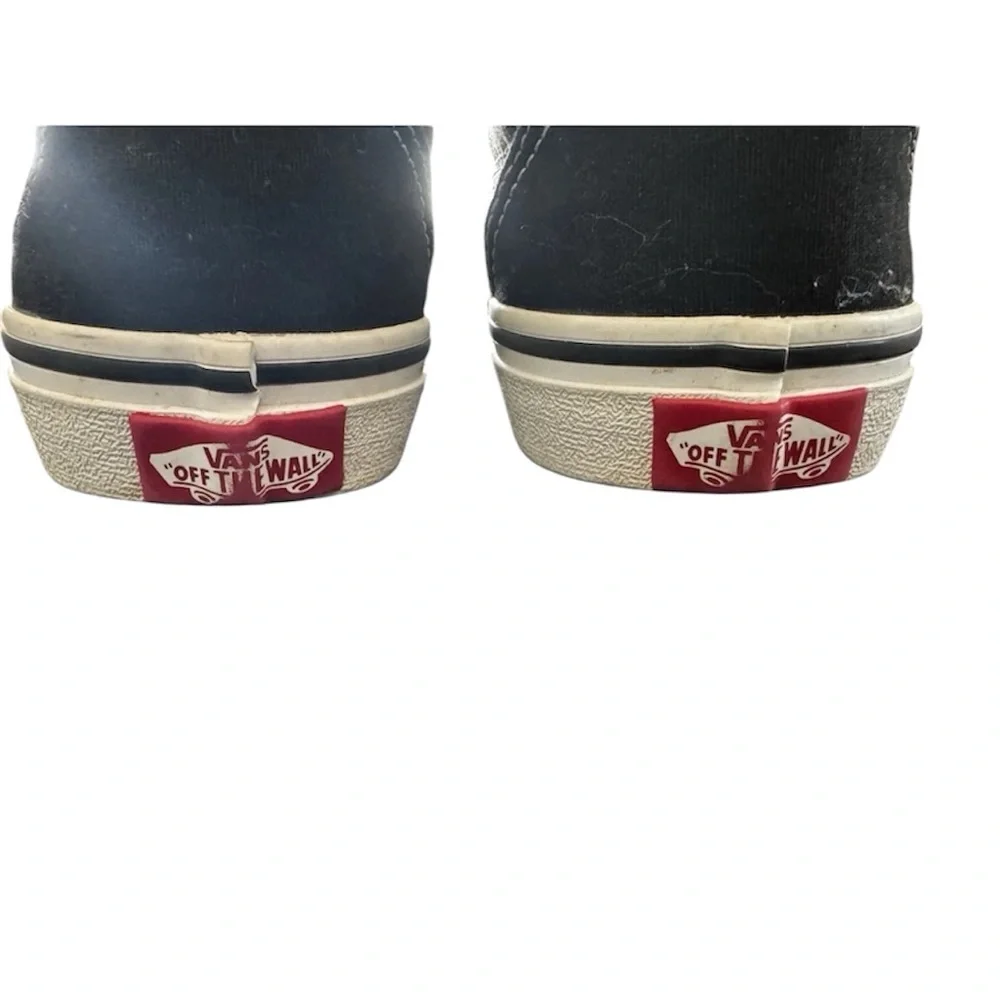 Vans Black and White Low-Top Slip-On Sneakers